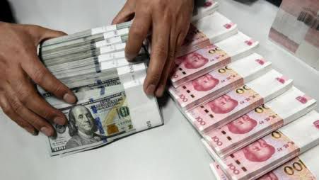 Yuan Drops to 7.1405 Against Dollar