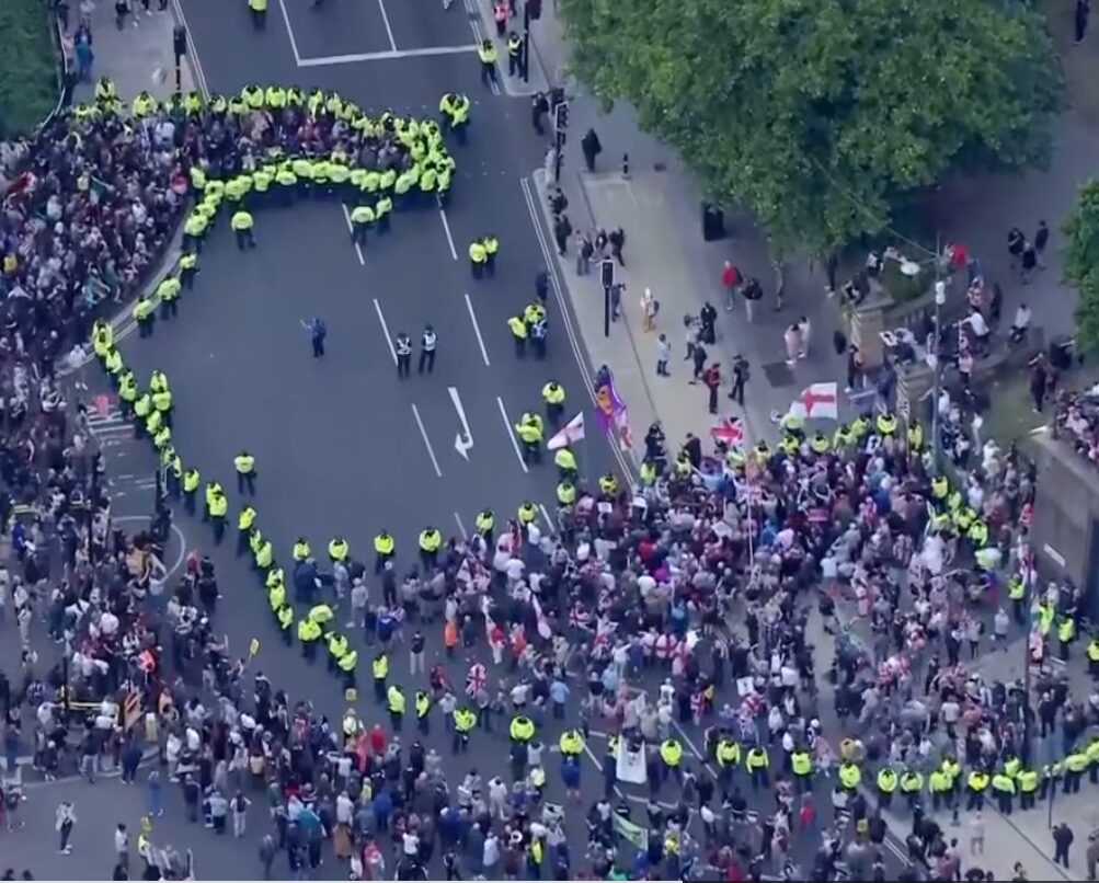 UK police clash with protesters at asylum hotels