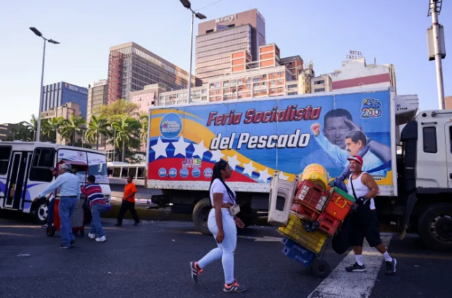Caracas residents move through their crowded plazas with familiar determination, yet a lingering unease now shadows daily routines as Venezuelans brace for possible US attack.