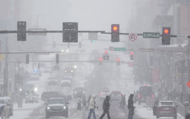US storm cuts power and grounds flights as winter weather paralyses large parts of the country